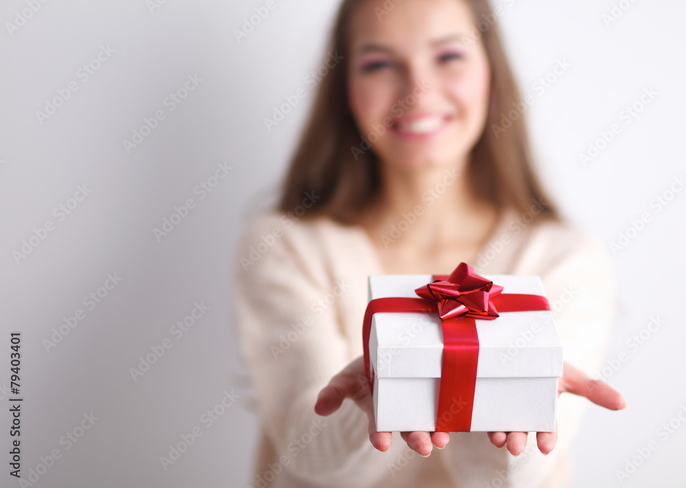 Young woman happy smile hold gift box in hands,standing over Young woman happy smile hold gift box in hands,standing over