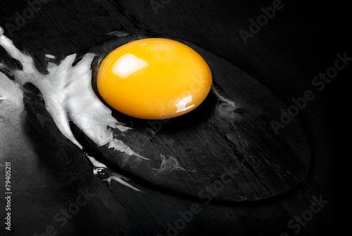 Raw Egg on Smooth Black Surface