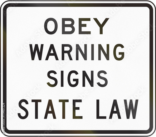 US traffic sign: Obey warning signs of state law