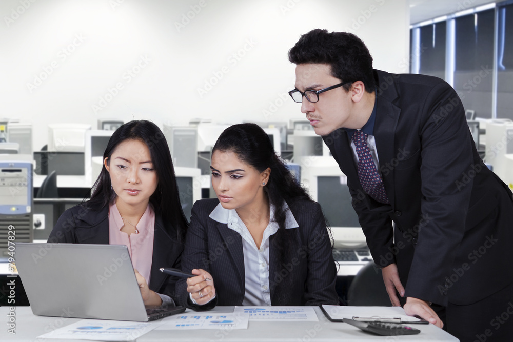 Business group having meeting in office room Business group having meeting in office room