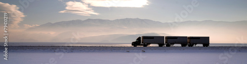 Semi Truck Travels Highway Over Salt Flats Frieght Transport
