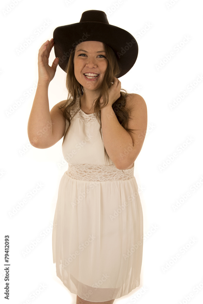 Cute cowgirl wearing a white dress smiling happy Cute cowgirl wearing a white dress smiling happy