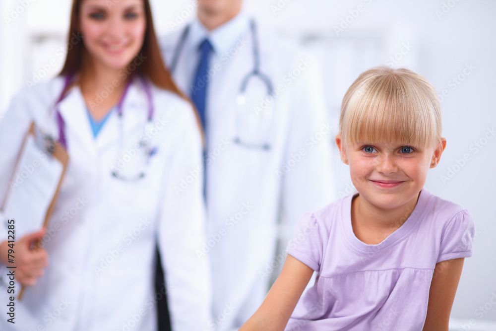 Female doctor examining child with stethoscope at surgery Female doctor examining child with stethoscope at surgery