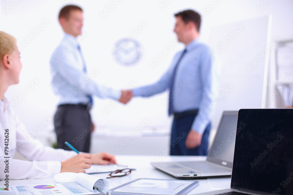 Business people shaking hands, finishing up a meeting