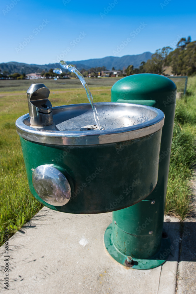 Naklejka premium Water stream squirts from a drinking fountain