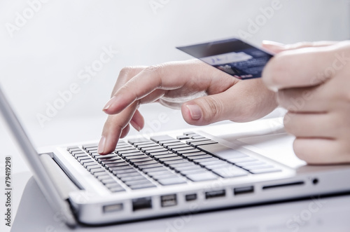 Shopping online with credit card on laptop photo