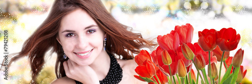 Beauty Woman with Beautiful bouquet fresh red tulips