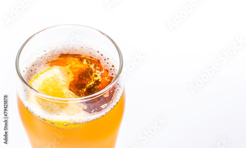 Glass of beer with lemon isolated on a white background