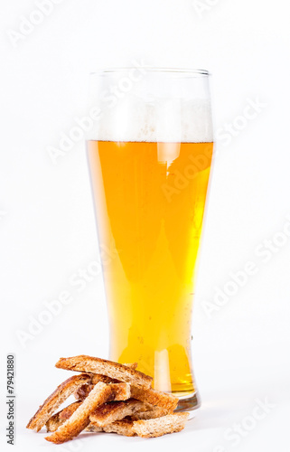 Glass of beer with toast isolated on a white background