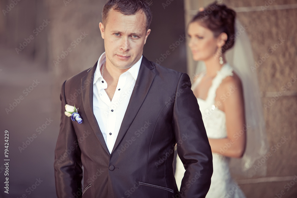 Groom and bride are walking in old town Groom and bride are walking in old town