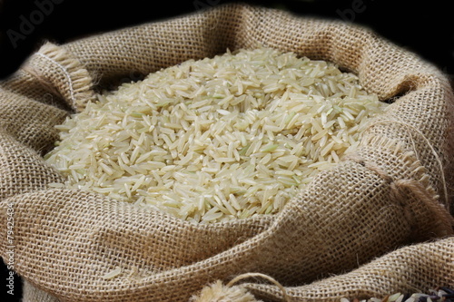 close up organic rice in sack bag