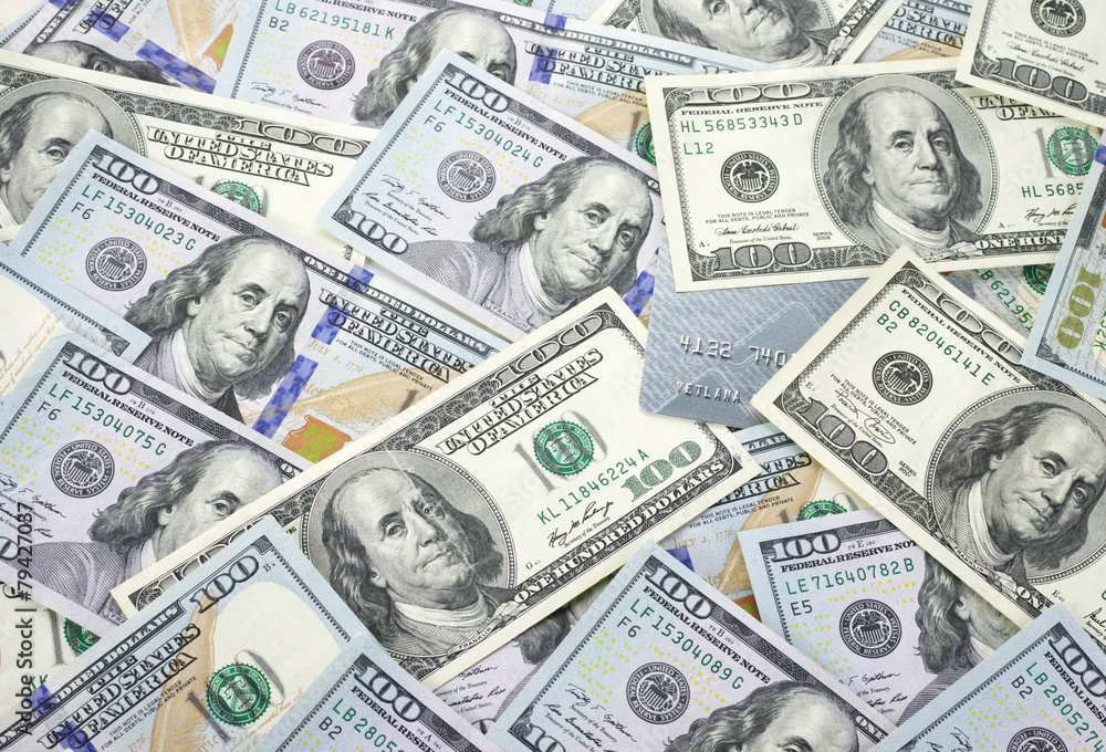 Money pile and plastic card Money pile and plastic card
