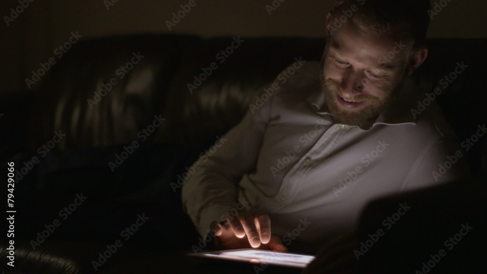 Man working late into the night from home. Man working late into the night from home.
