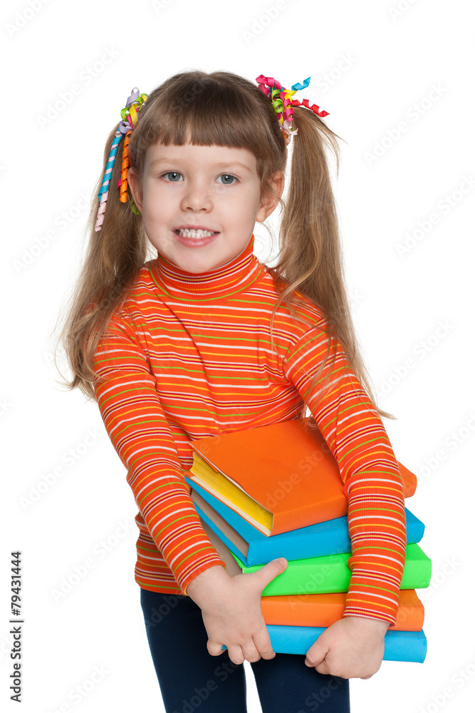 Clever little girl holds books Clever little girl holds books