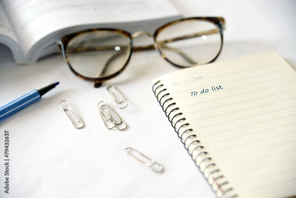 Opened personal organizer with a to do list Opened personal organizer with a to do list