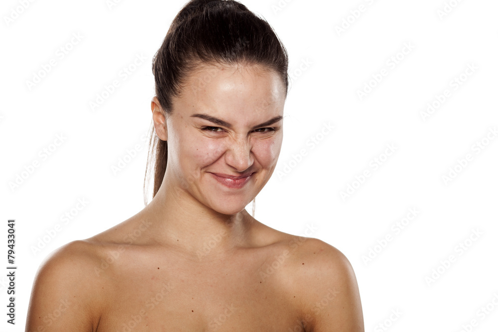 smiling cute young woman with a frowning face smiling cute young woman with a frowning face