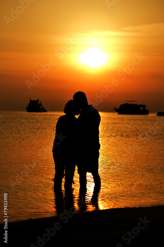 couple at sea at sunset