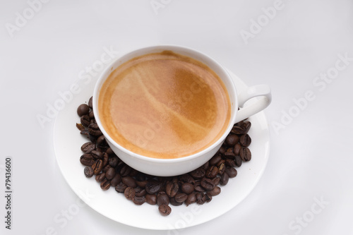 cup of coffee over white background © Denis Ovcharenko