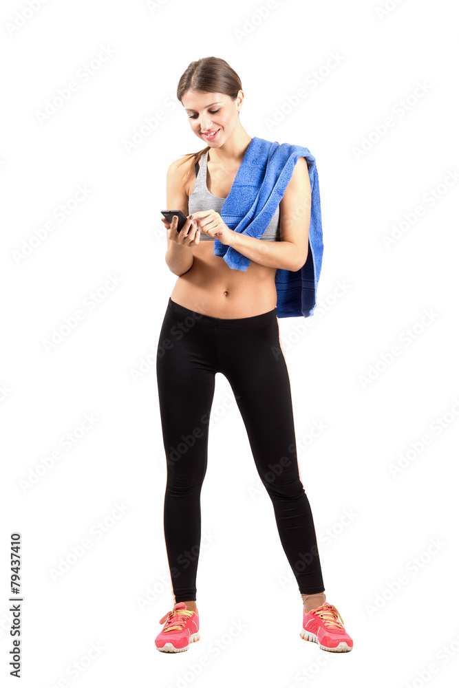 Sporty fitness woman using mobile phone Sporty fitness woman using mobile phone