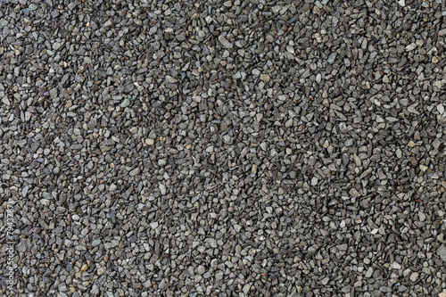 Background from basalt sand and stones - macro photo.