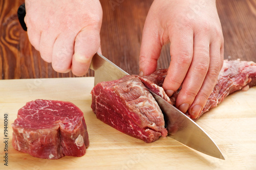 cutting raw beef