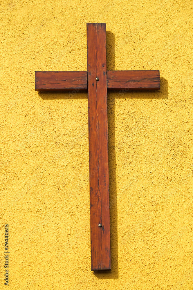 Wooden cross on the wall of the church