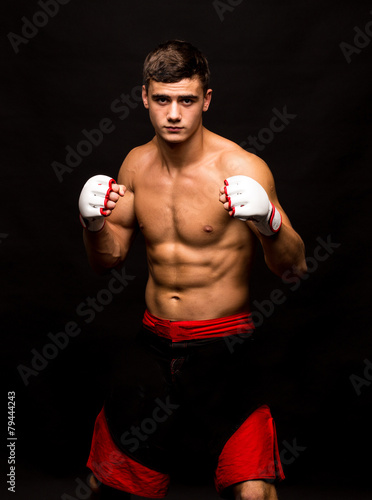 Male model. Kickboxing. © indigolotos