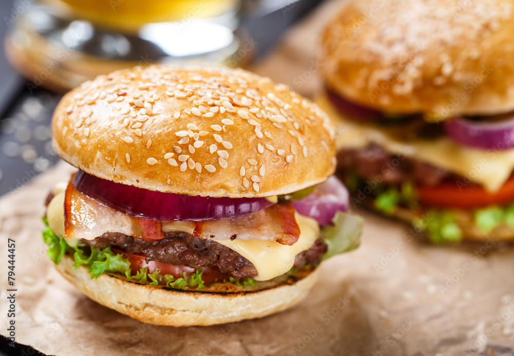 Delicious burger on wooden board Delicious burger on wooden board
