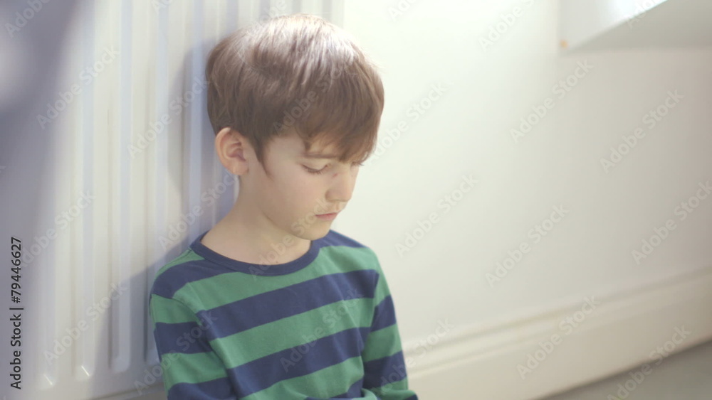 Young boy playing games on a touchscreen tablet Young boy playing games on a touchscreen tablet