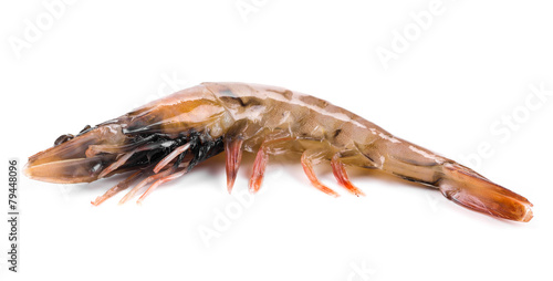 Raw shrimp on plate.