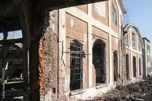 Demolished ruins of facade of old railway factory