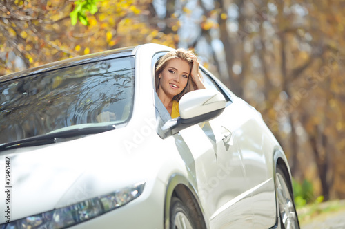 Smiling woman sitting in car © nuzza11