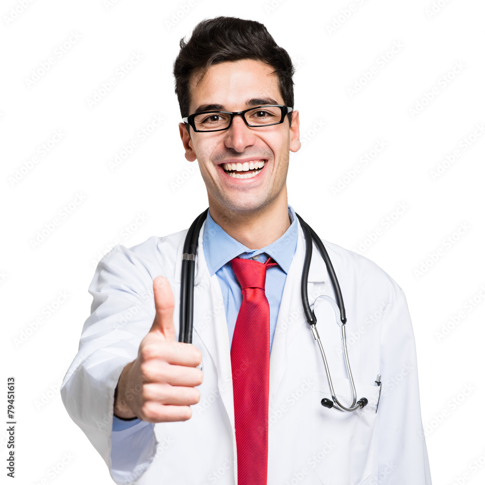 Portrait of a friendly doctor smiling giving thumbs up