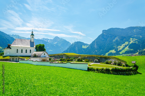 Beautiful alpine landscape with typical alpine church  Austria