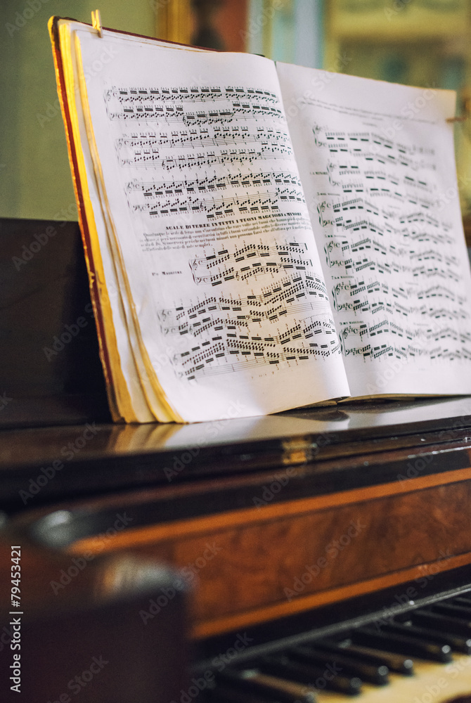 Fototapeta premium Vintage photo of old piano with notes.