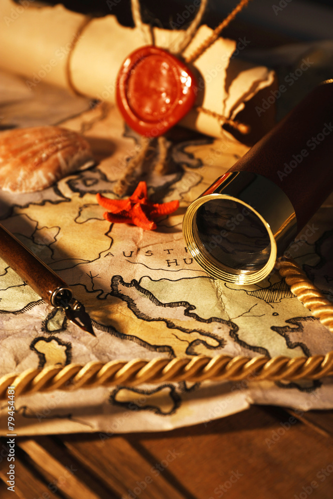 Marine still life with world map on wooden table background