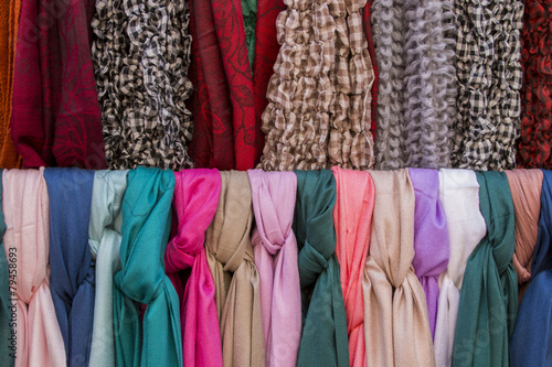 Close up view of many stylish scarfs for sale in a store. © Mauro Rodrigues