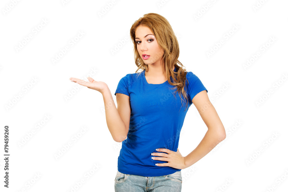 Young woman presenting a product. Young woman presenting a product.