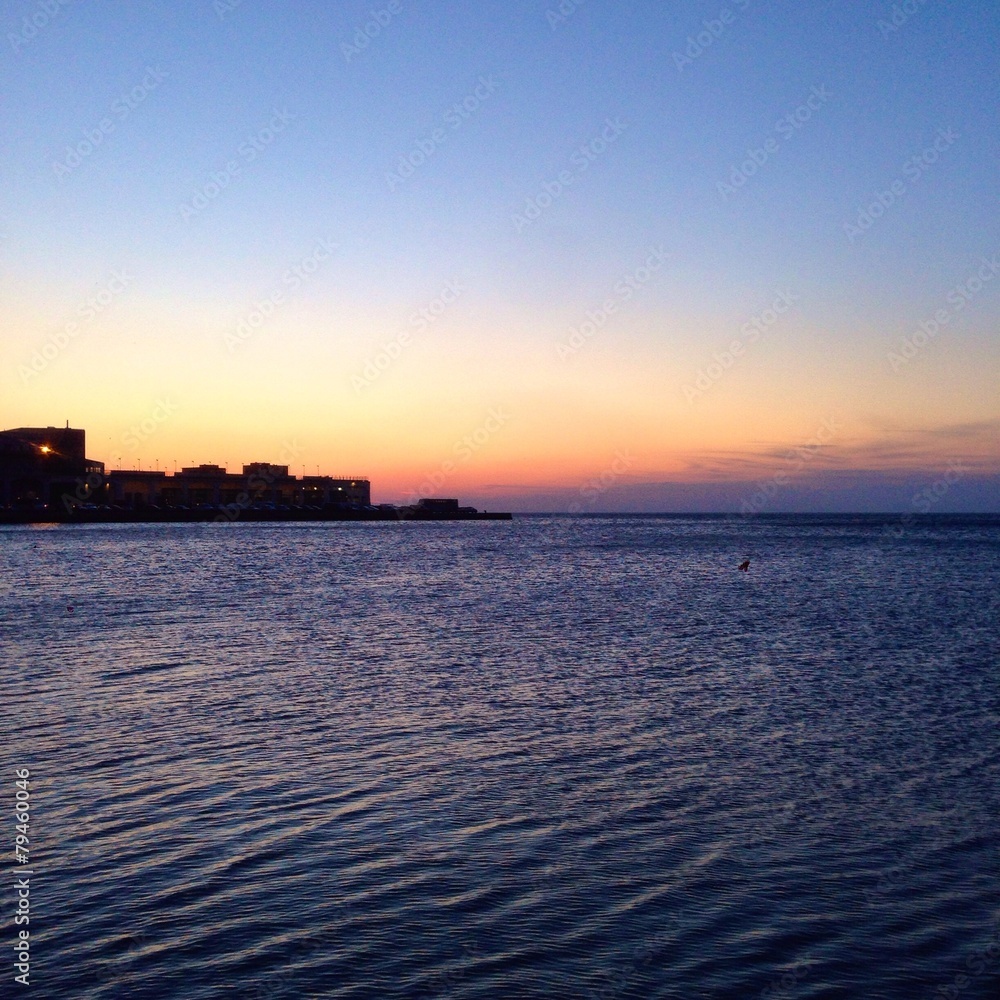 Trieste's harbor view at sunset