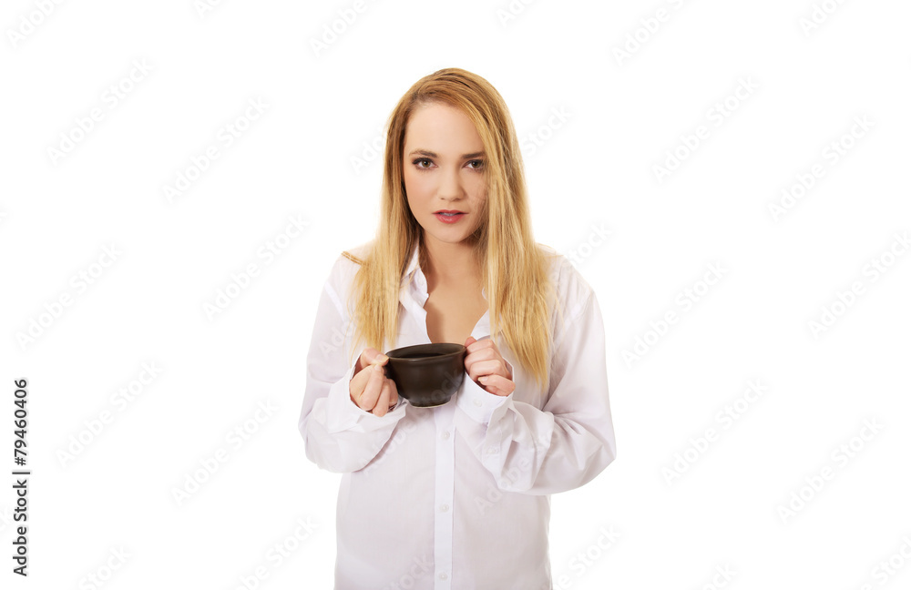 Woman in long sleeve shirt drinking coffee. Woman in long sleeve shirt drinking coffee.