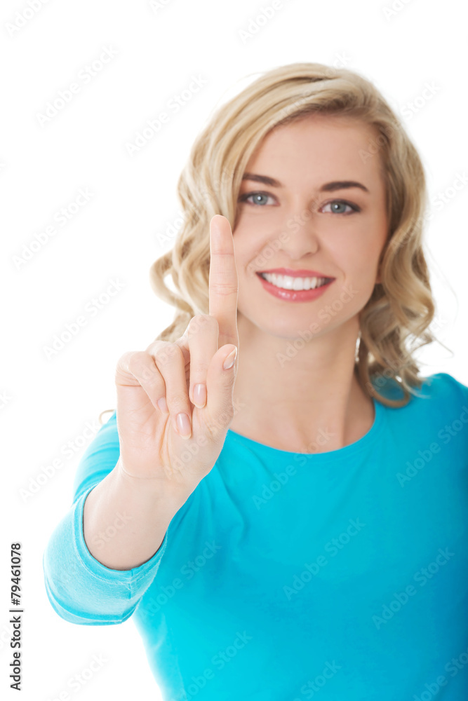 Portrait of woman pushing imaginary button Portrait of woman pushing imaginary button