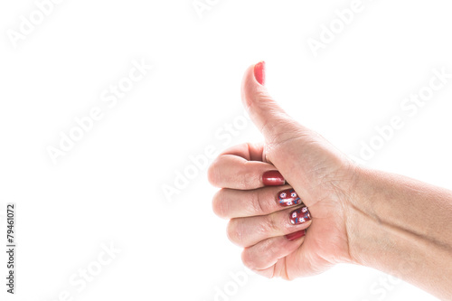 Female hand showing OK sign on a white background
