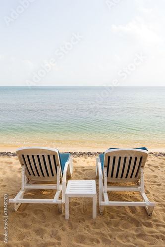 Fototapeta Naklejka Na Ścianę i Meble -  Two beach chairs at the empty Maenam Beach in Koh Samui