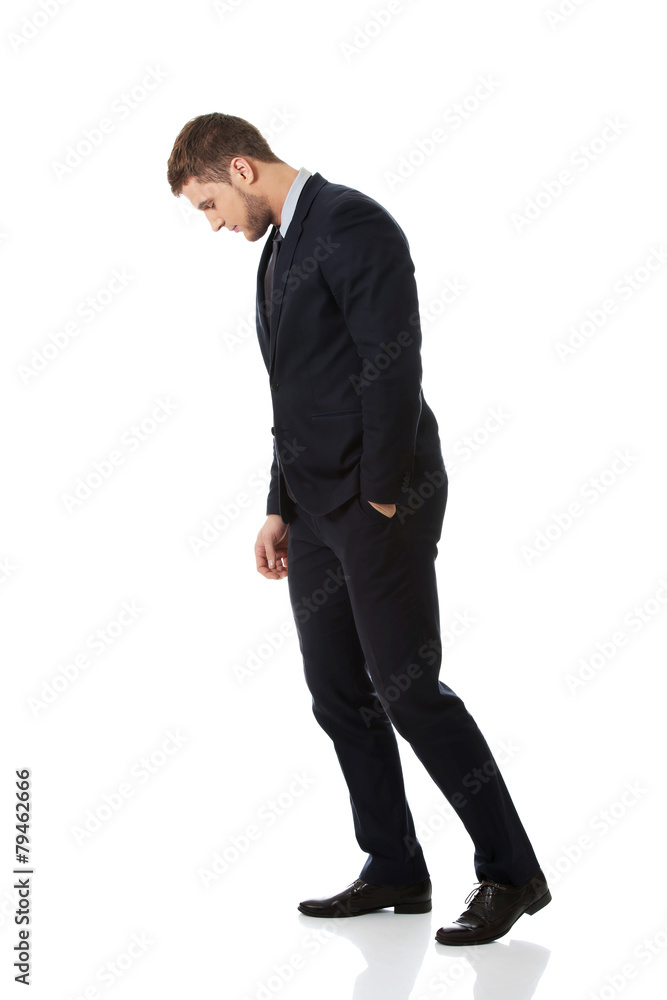 Businessman looking down on the floor. Businessman looking down on the floor.