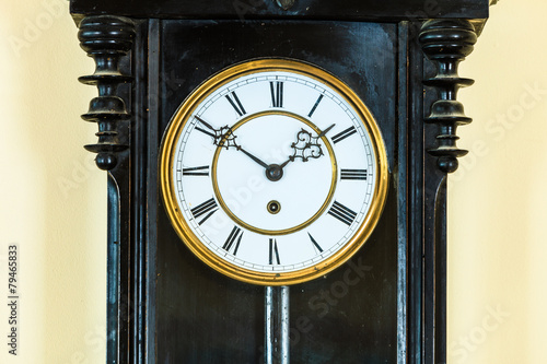 Closeup old clock on wall