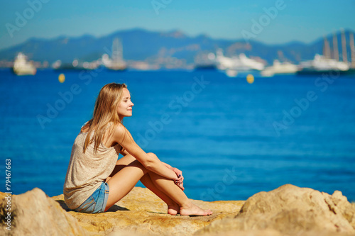 Beautiful girl enjoying her vacation by the sea © Ekaterina Pokrovsky