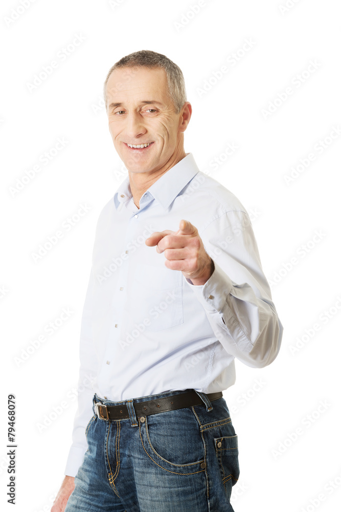 Happy handsome man pointing at you Happy handsome man pointing at you