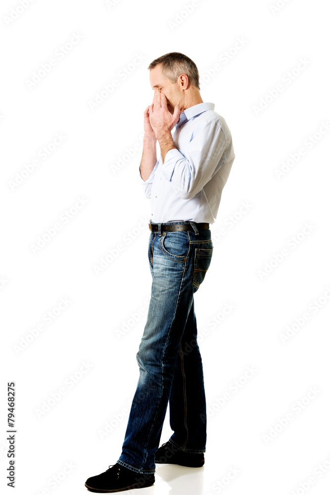 Man holding his nose because of sinus pain Man holding his nose because of sinus pain
