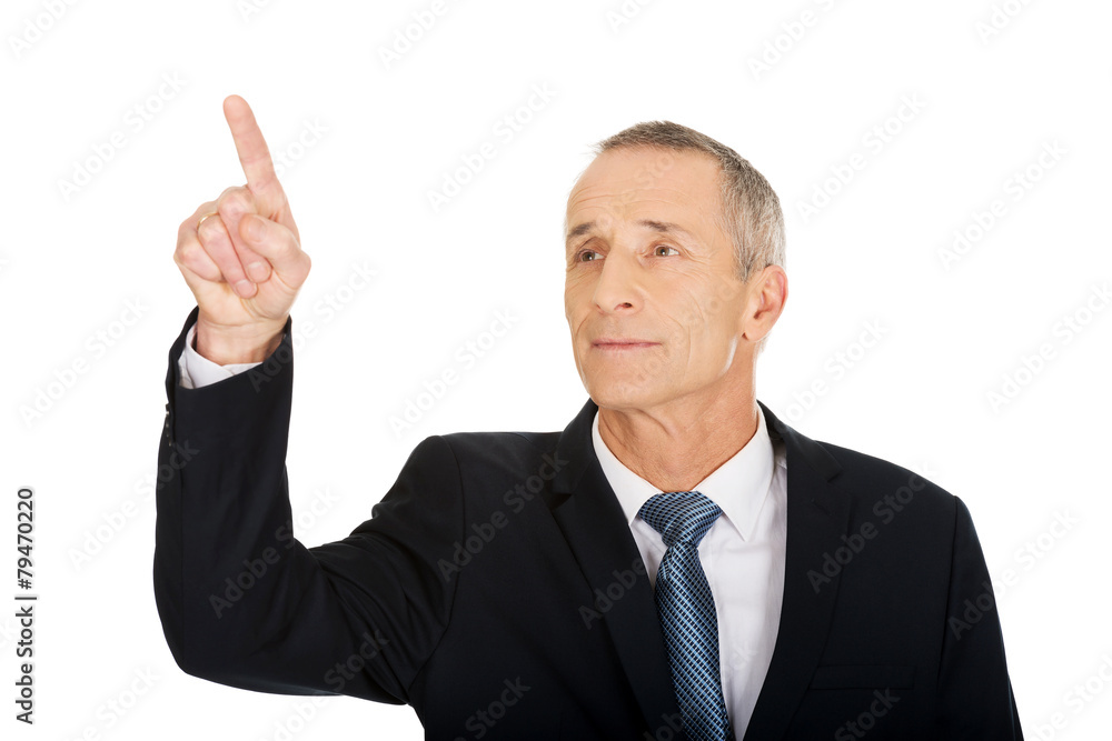Businessman pressing abstract button Businessman pressing abstract button