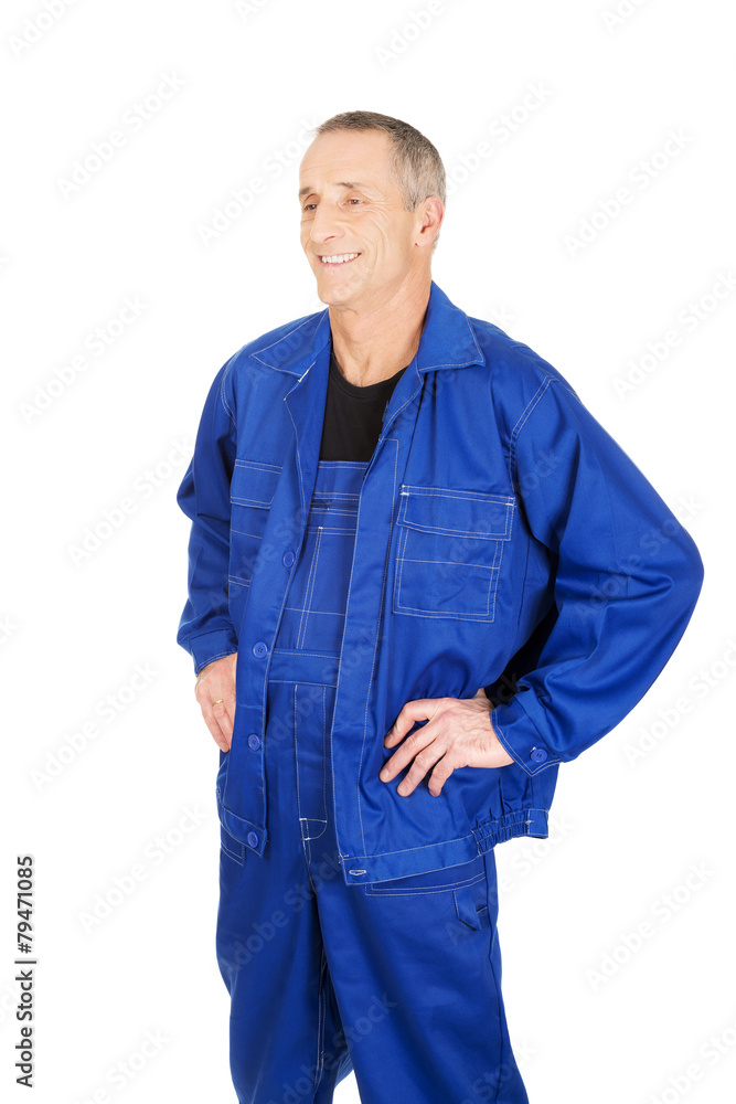 Smiling repairman with hands on hips Smiling repairman with hands on hips